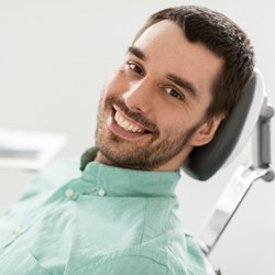 man smiling in dentist chair