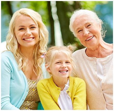 Mother daughter and granddaughter smiling together