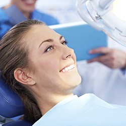 Woman in dental chair smiling