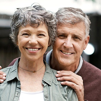 Smiling older mand and woman outdoors