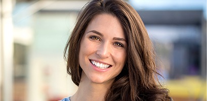 Woman with beautiful smile outdoors