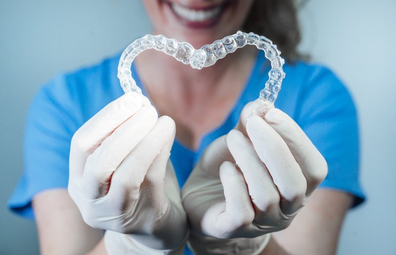 Doctor holding Invisalign